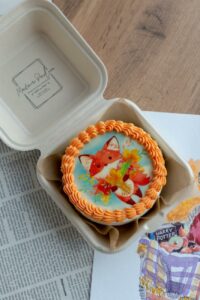 homemade cake decorated with a cartoon fox drawing